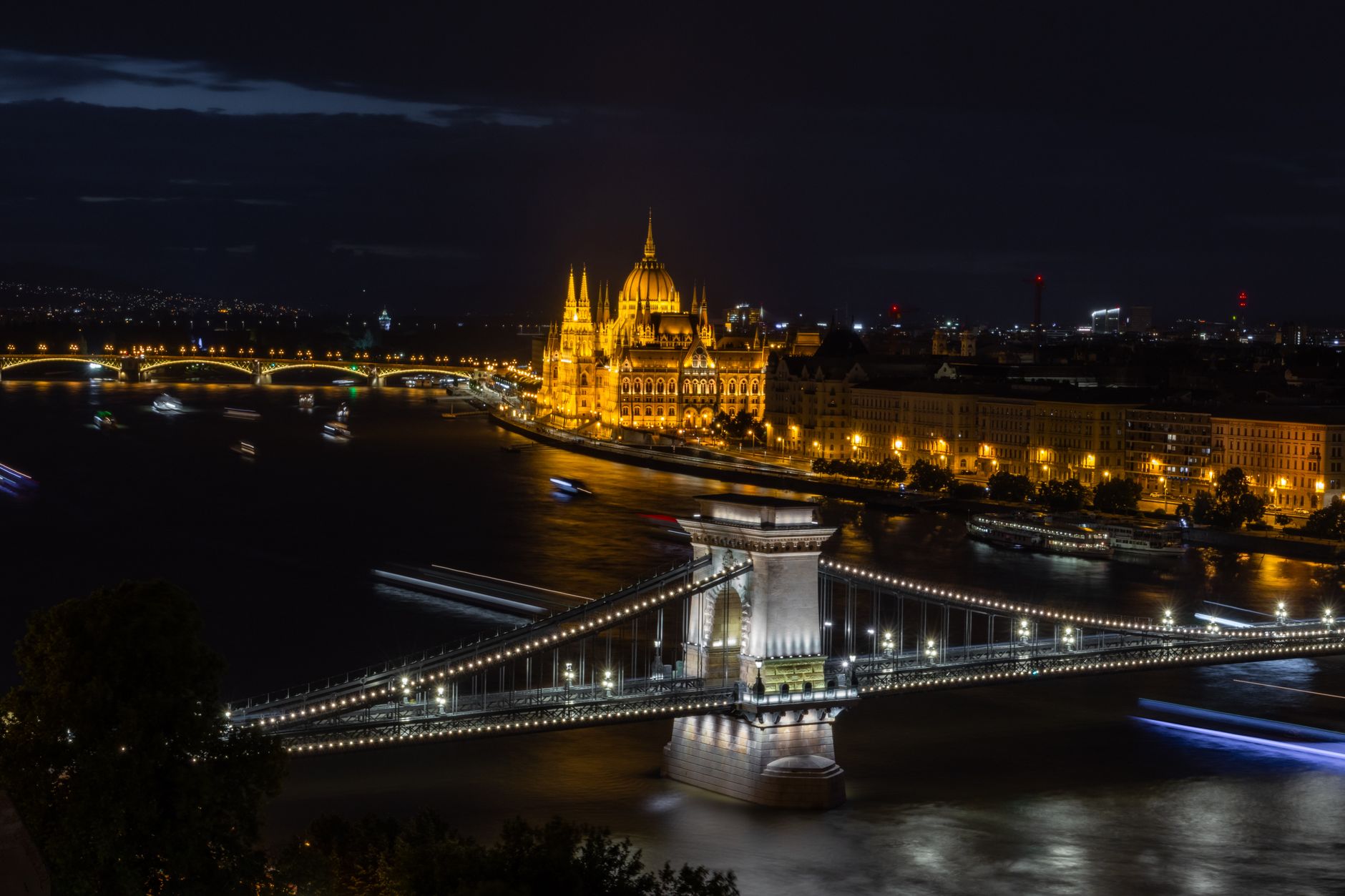 Budapest glowing over the Danube at night