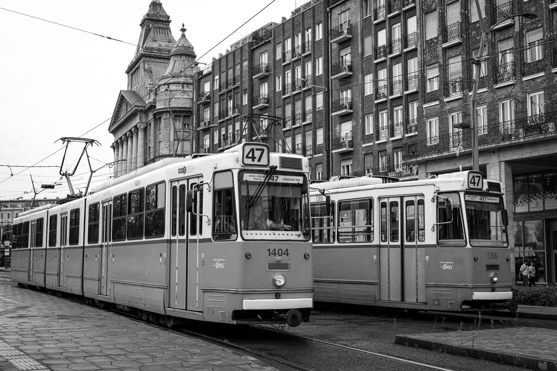 A yellow tram on a Budapest boulevard